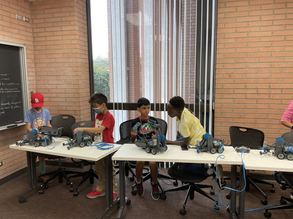 Students working on Vex Robotics Kits.